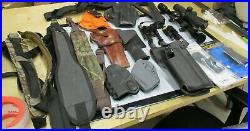 Box of Misc rifle slings, holsters, and scopes etc
